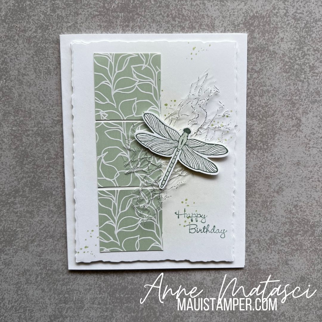 a white card with 3 soft green squares and a dragonfly