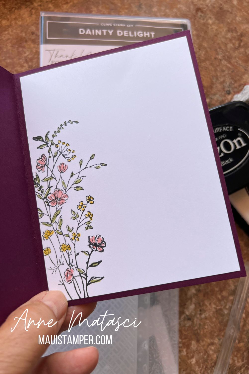 White card panel with small flowers