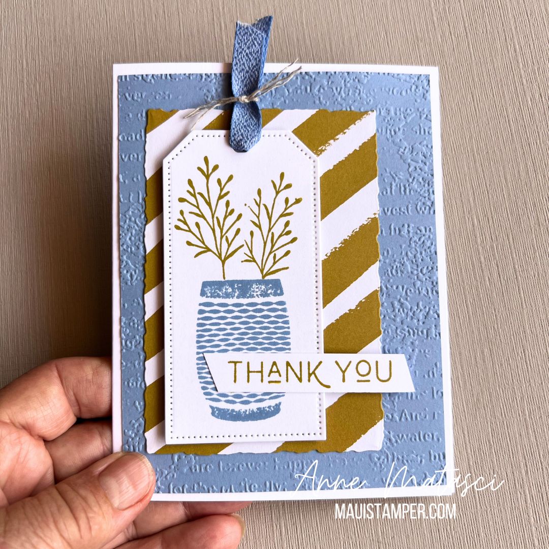 handmade card with a large vase with stems and a striped paper accent on a white card base with the sentiment “thank you”