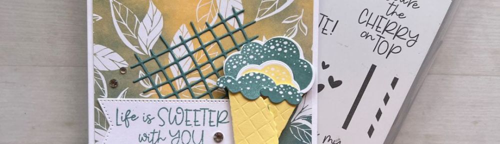 A Handmade card with a patterned paper background, ice cream cone, and the sentiment “Life is Sweeter with You”