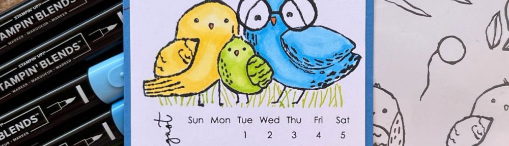 A Handmade calendar page for August with 3 birds colored blue, yellow and green.