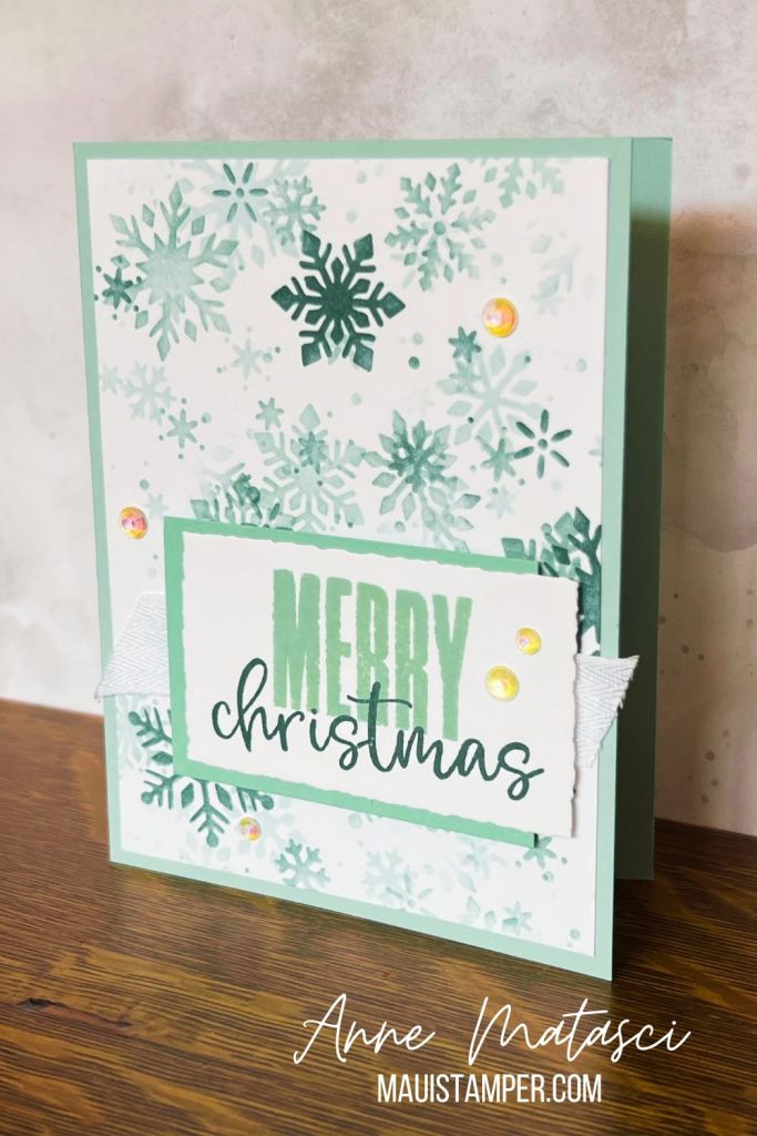 A handmade card with a snowflake pattern and the text “Merry Christmas”