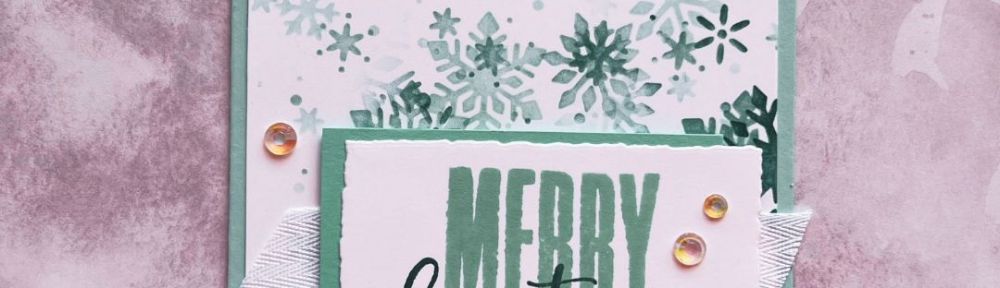 A handmade card with a snowflake pattern and the text “Merry Christmas”