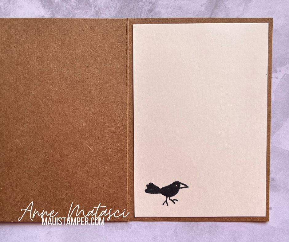 inside of the note card with a small black bird.