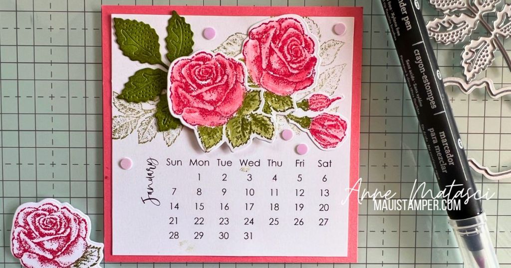A handmade calendar page for January with the pink roses and green leaves