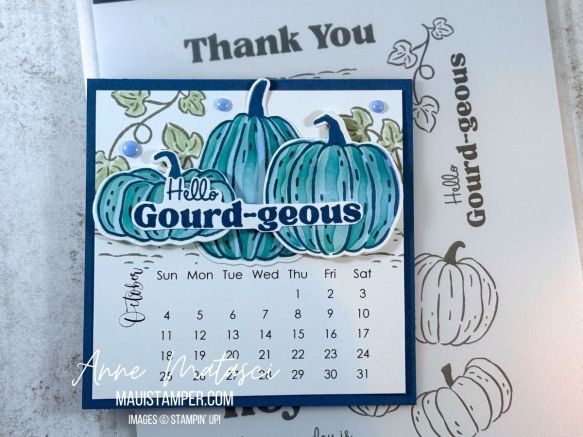 an October calendar featuring blue pumpkins