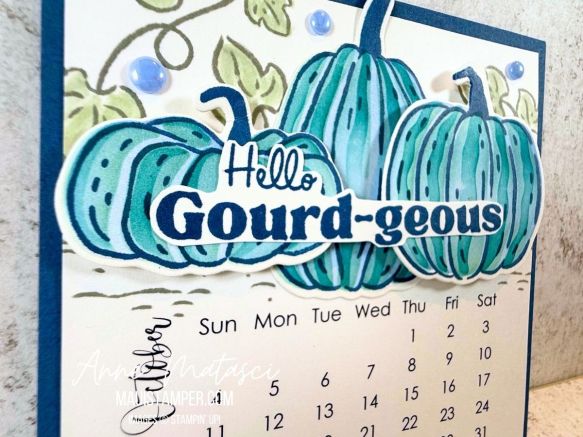 an October calendar featuring blue pumpkins