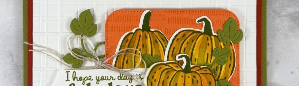A card featuring 3 orange pumpkins